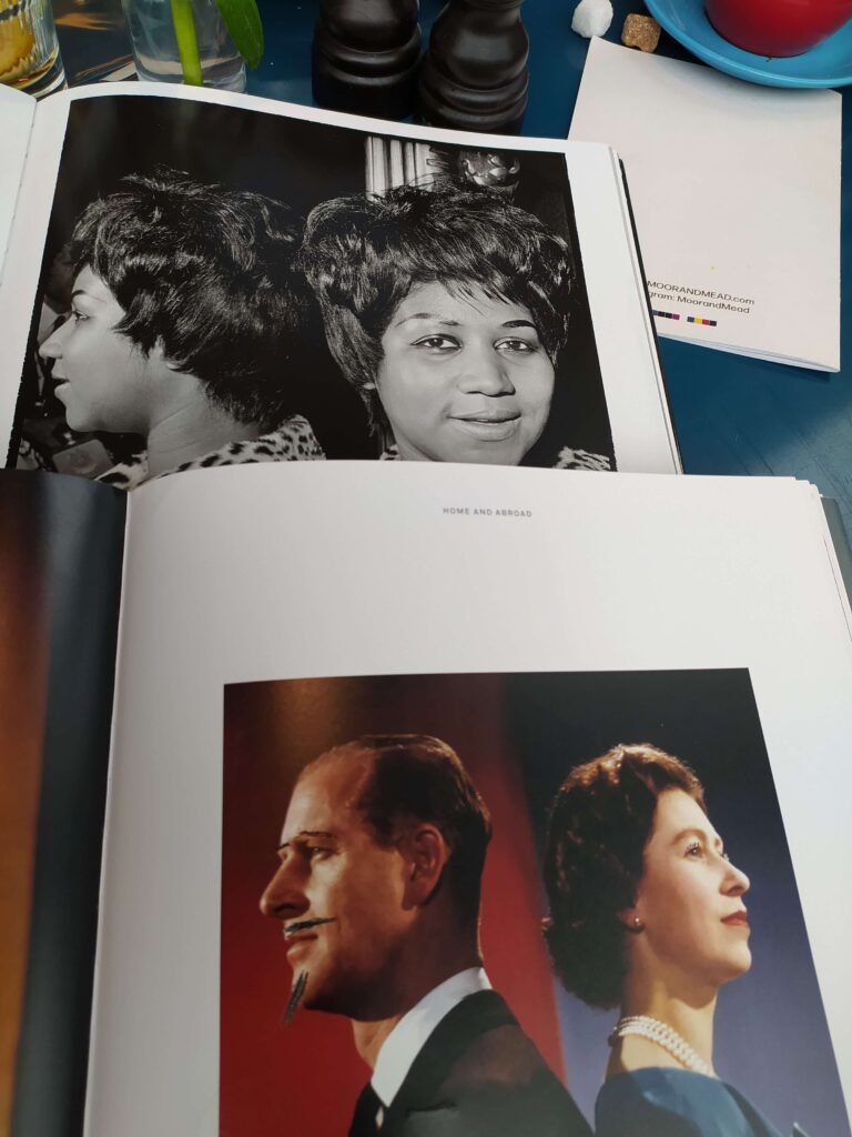 Book photos - Aretha Franklin in one coffee-table book; Queen Elizabeth and Prince Philip (with added biro moustache and beard) in another